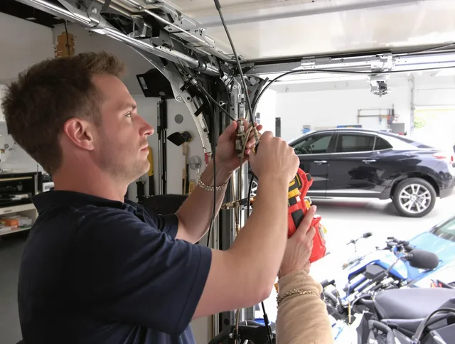 Redlands Garage Door Repair safety certified technician performing cable replacement in Redlands