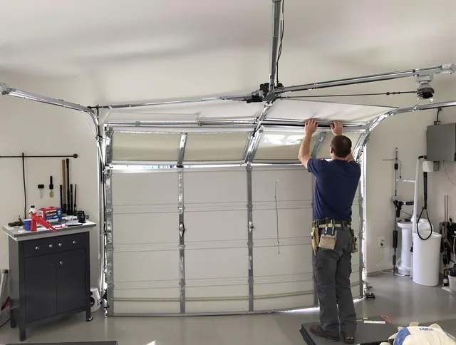 Redlands Garage Door Repair specialist performing precise section replacement on Redlands garage door